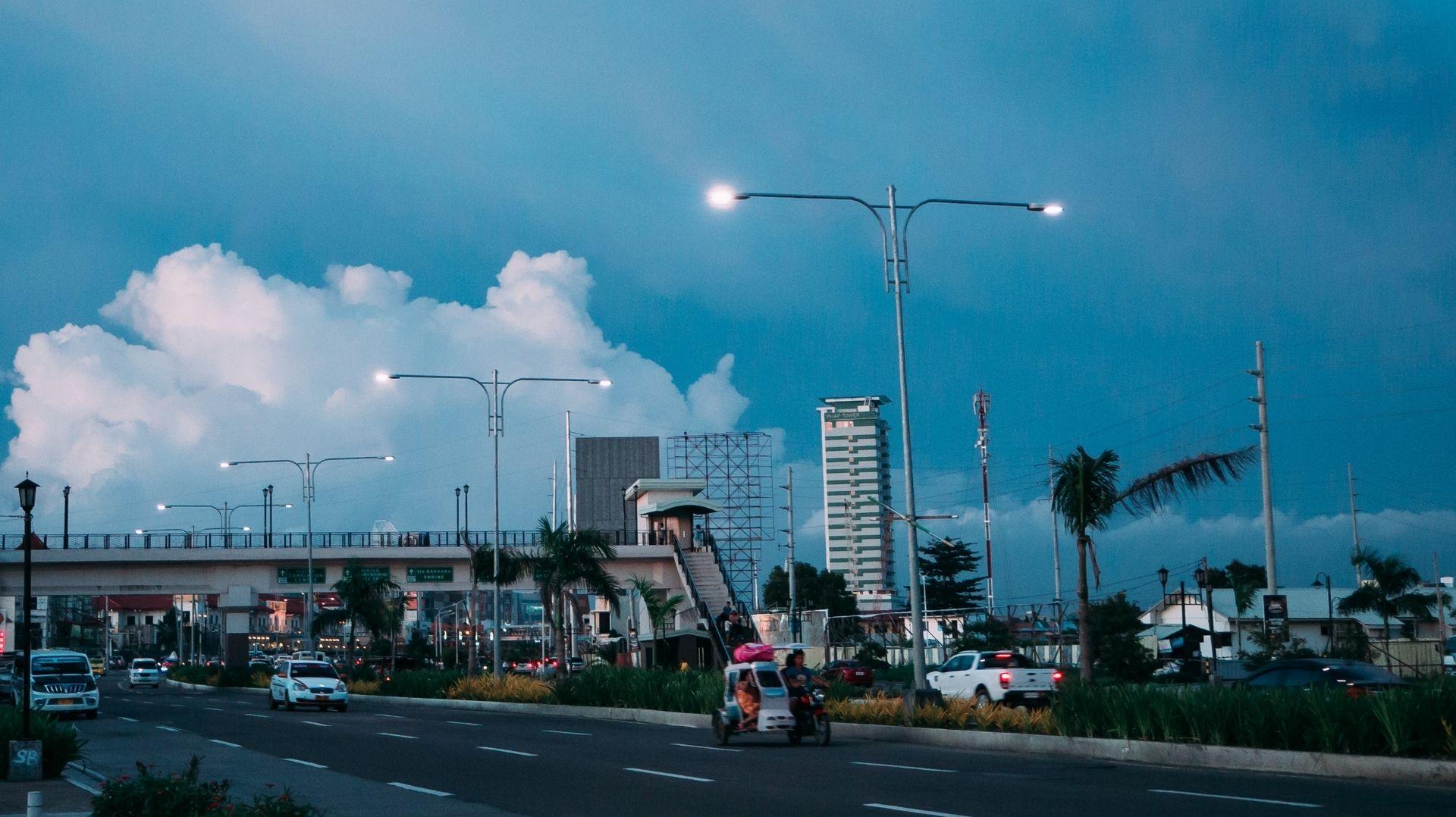 Iloilo City night scene with lively streets, glowing lights, and a vibrant nightlife atmosphere
