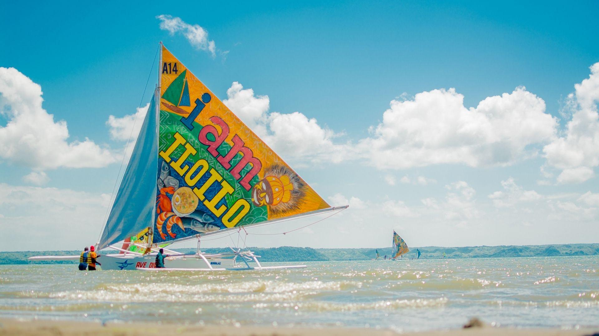 Paraw Regatta Festival in Iloilo City, the Philippines’ oldest sailing event featuring colorful paraws racing across the Iloilo Strait