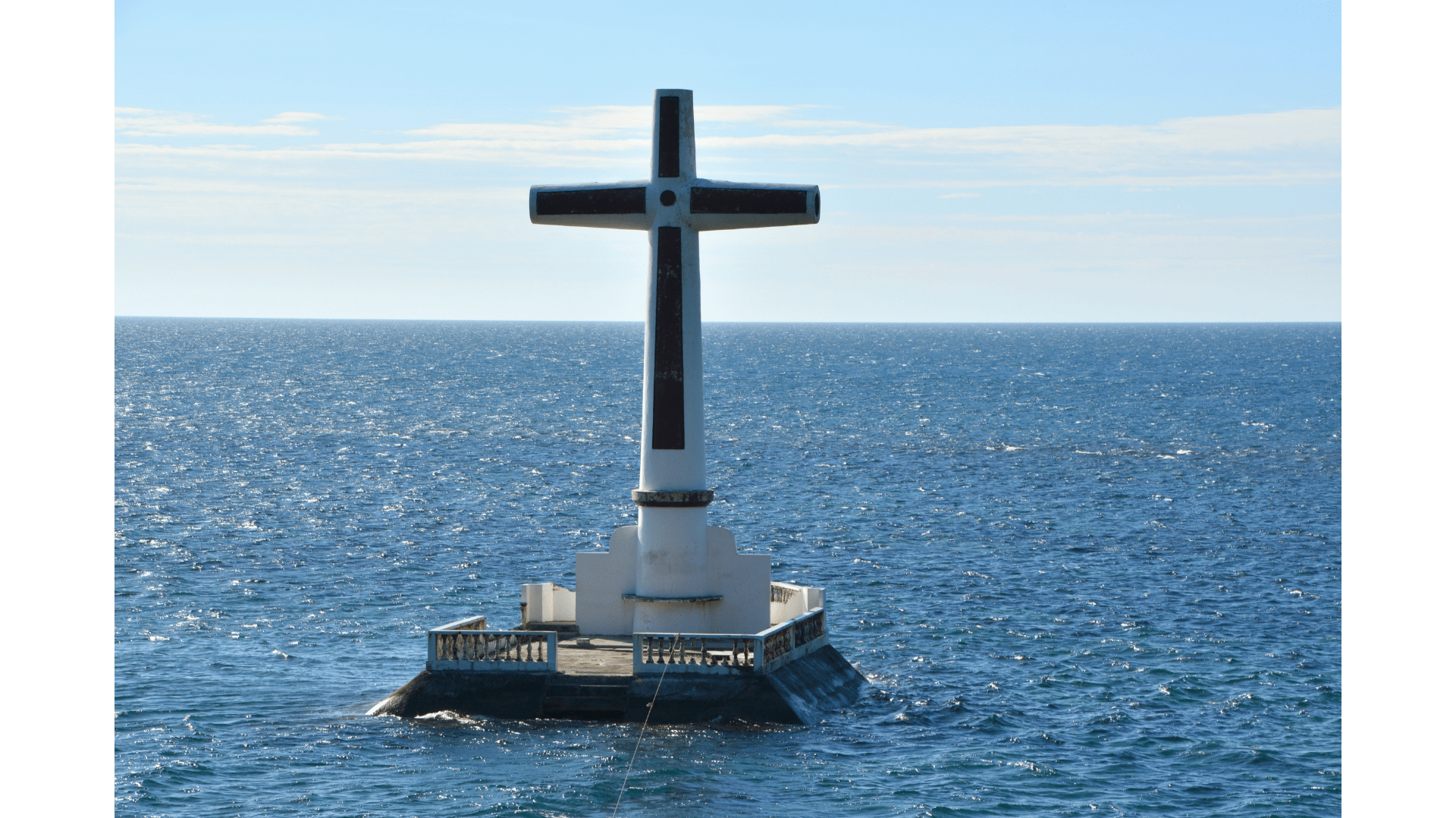 The Sunken Cemetery in Camiguin is a historic landmark marked by a giant cross rising from the sea