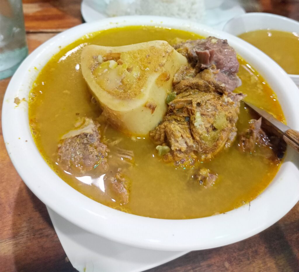 Kansi is an Ilonggo beef soup that blends bulalo’s richness with sinigang’s tang, made vibrant with annatto.