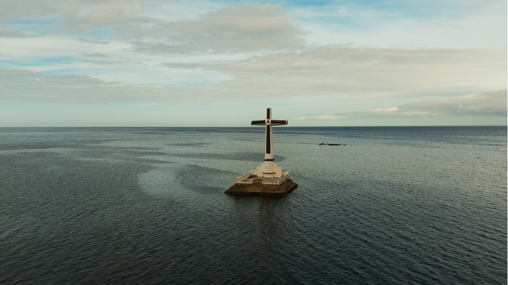 sunken cemetery cross in camiguin island, philippines