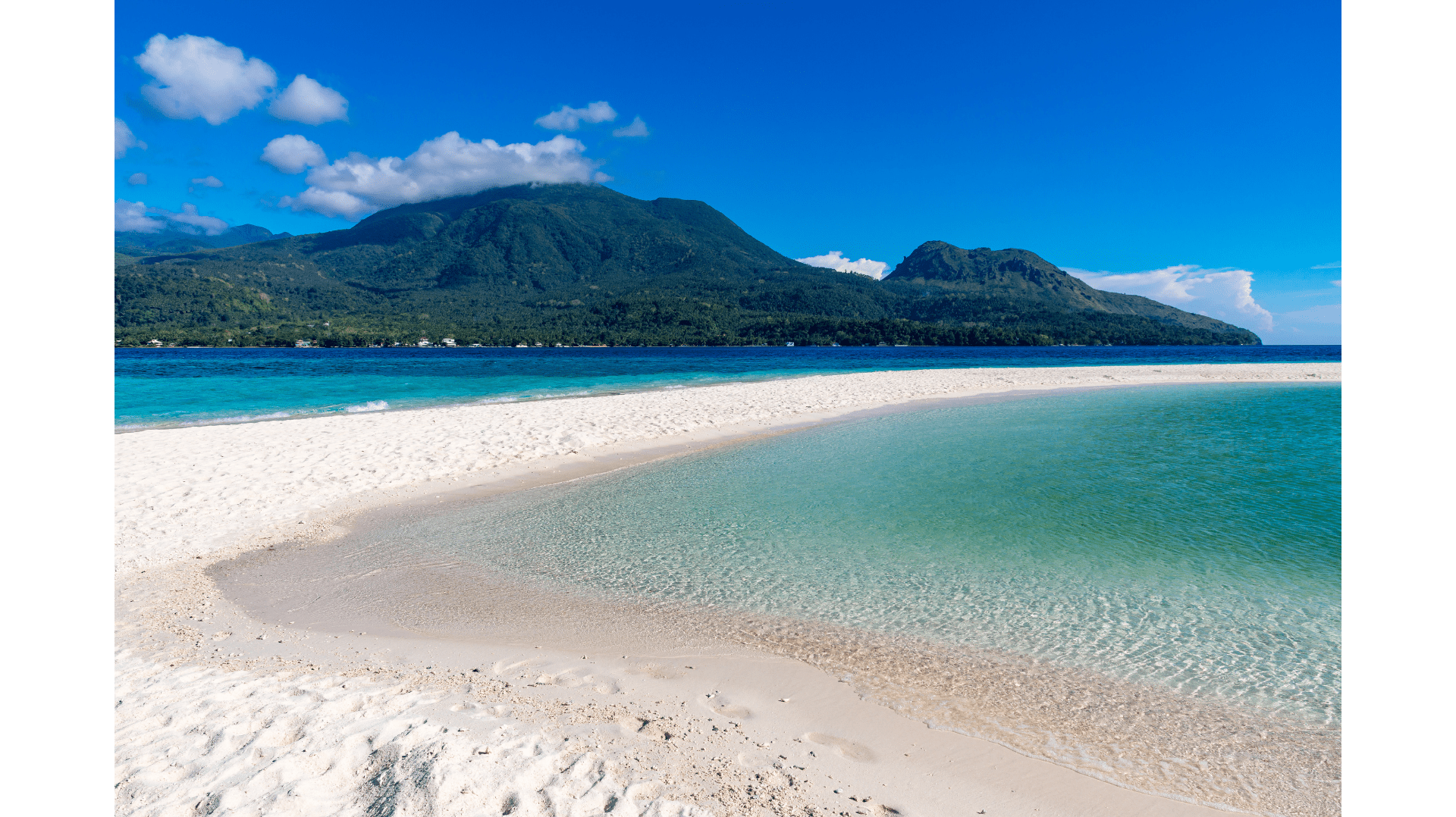White Island Sandbar in Camiguin boasts pure white sand and stunning ocean views.